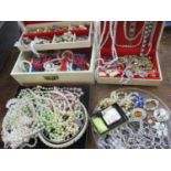 A quantity of costume jewellery to include earrings and beads together with a 1970's jewellery box