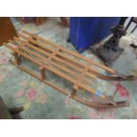 A vintage beech sledge/toboggan, stamped Davoser