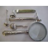 A small lot of silver to include a silver handled magnifying glass