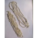 A Biwa pearl three strand necklace and a similar bracelet