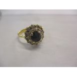 A 9ct gold sapphire and diamond ring of stepped design
