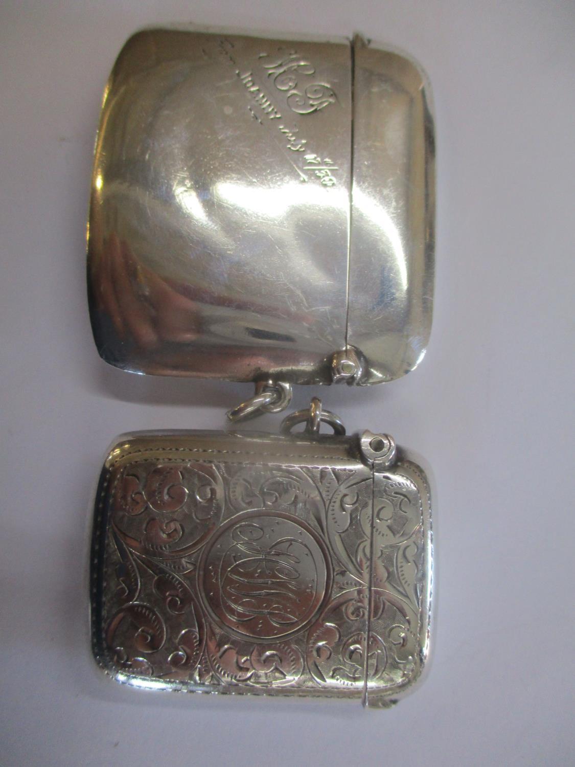 Two silver vesta cases to include one with initials HJ and dated 17th July 1930