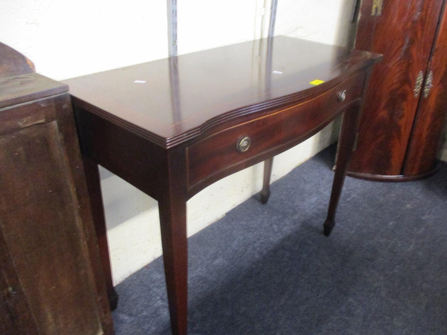 A reproduction mahogany side table with single long drawer Location: BWR