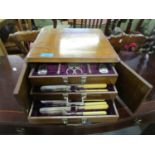 A Victorian walnut cased canteen of silver plated cutlery, three drawers containing a front set with