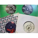 Two 1960s Beatles 45rpm records, A Hard Days Night and All you Need is Love by EMI Records Ltd,
