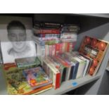 A selection of Sports memorabilia to include scrap albums, football DVDs and videos, a book on