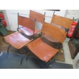 A set of fair Charleston Forge chairs with wrought iron X frames and leather back and seats