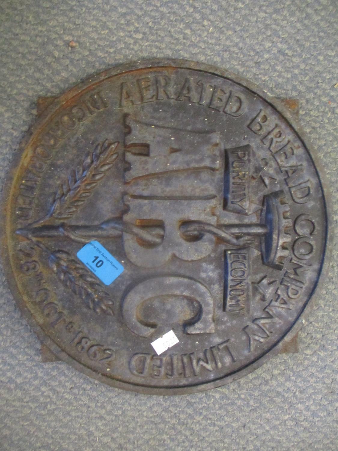 A cast iron Aerated Bread Co plaque