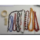 Jewellery to include amber coloured necklaces, bone jewellery and beaded necklaces