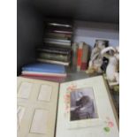 Books and a Victorian photograph album A/F containing twenty monochrome photographs