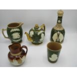 A group of four Copeland Spode George V and Victorian commemorative ware with raised decoration on a