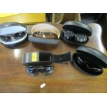 A group of five cased designer sunglasses, to include Prada, Ben de Lisi, Bruce Oldfield and Maria
