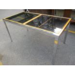 A modern chrome and glass topped extending dining table, 76 1/2" h x 155"w