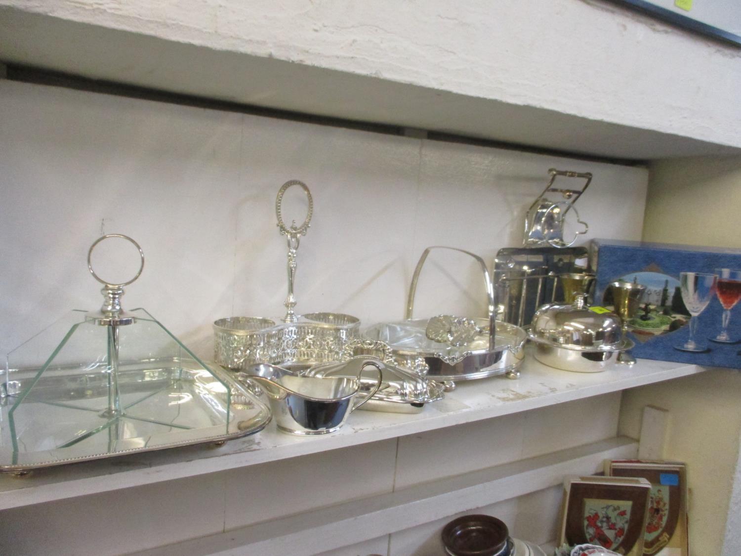 Mixed silver plated table serving items to include a muffin dish and entrée dishes, together with