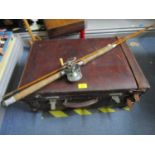 A Darnborough & Sons vintage leather travelling case and a split cane fishing rod with a Penn reel