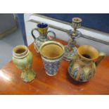Five items of Doulton Lambeth and Royal Doulton ceramics to include a candlestick, a beaker, two