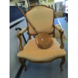A salon armchair with peach coloured upholstery, together with a copper warming pan