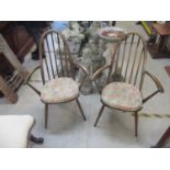 a pair of 1960's Ercol Windsor dining chairs with arms