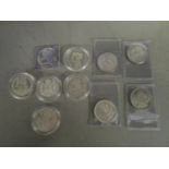A group of ten silver coins to include four Morgan Dollars, various mint marks and years, American