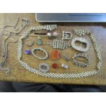 A selection of costume jewellery to include a Victorian agate stone buckle, various other paste