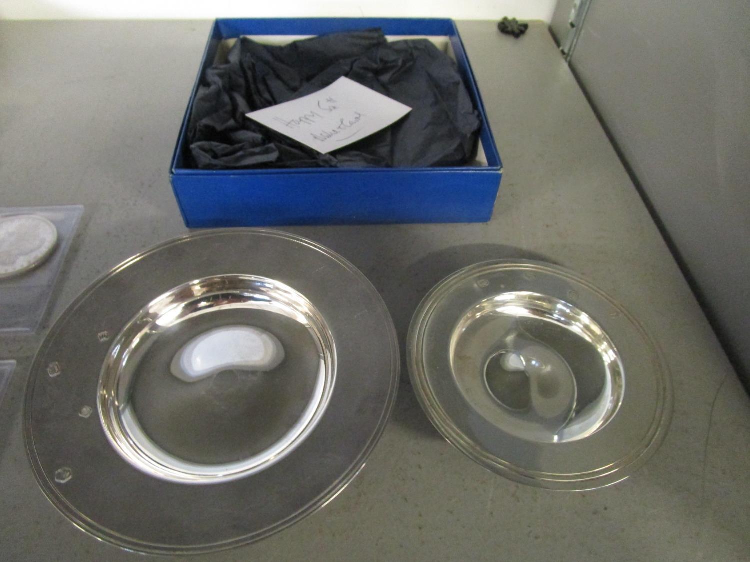 A silver armada dish, Sheffield 1996, R C mark for R. Carr Ltd, 12 1/2 cm diameter and a smaller