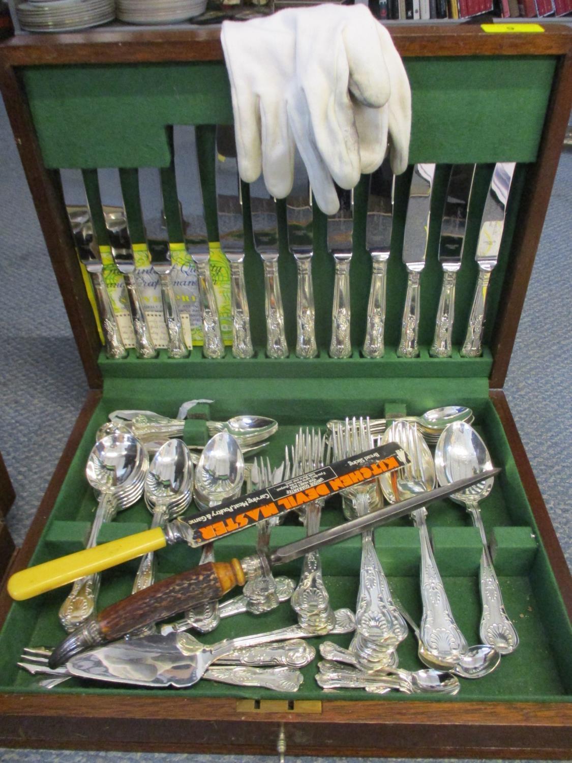 A Canteen of silver plated, six setting cutlery, together with a bone handled knife sharpener and