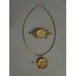 A silver gilt pendant necklace and matching brooch in the form of a Tudor Rose, London hallmarks,