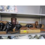 Mid 20th century ebony elephants, African tourist treen items, a wooden desk blotter, a carved