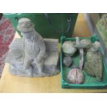 Garden stoneware to include a man on a bench, animals and mushrooms