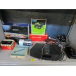 A mixed lot to include two Canon cameras, a Bose wave radio a boxed 3D Viewer and Paterson slide