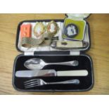 A silver christening set with a stainless steel knife, cased and costume jewellery, a Wedgwood