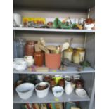 A miscellaneous lot of kitchenalia to include stoneware jars, wooden spoons, mincers, jelly