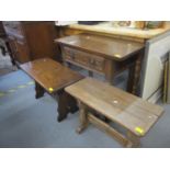 A mid 20th century oak side table with single drawer, together with two trestle end bench style