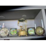 A mid-century musical bird in a cage box, two Noddy alarm clocks and two Mickey Mouse alarm clocks