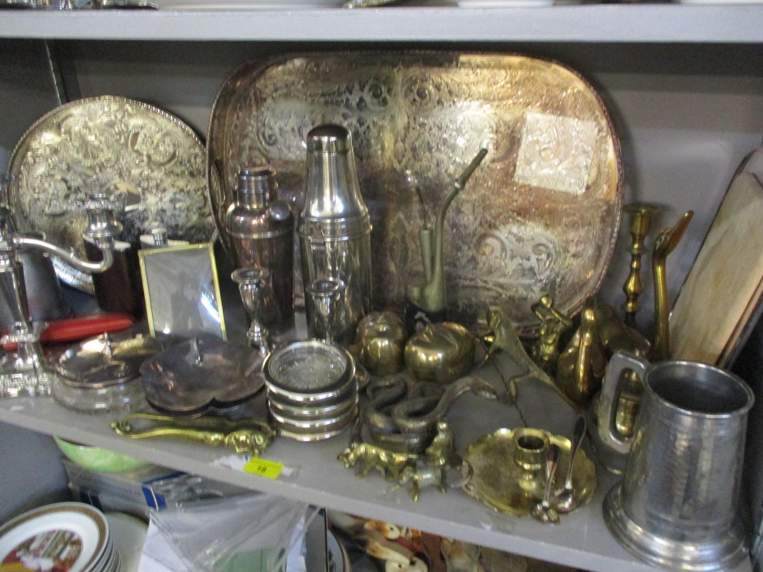 A quantity of silver plate and mixed metalware to include a cocktail shaker, two trays, a pair of