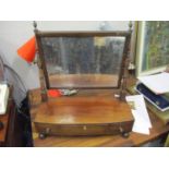 A 19th century mahogany three drawer toilet mirror on turned feet