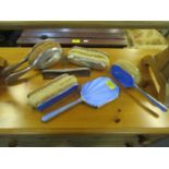 A silver and blue guilloche enamelled dressing table brush an d hand mirror set and another dressing