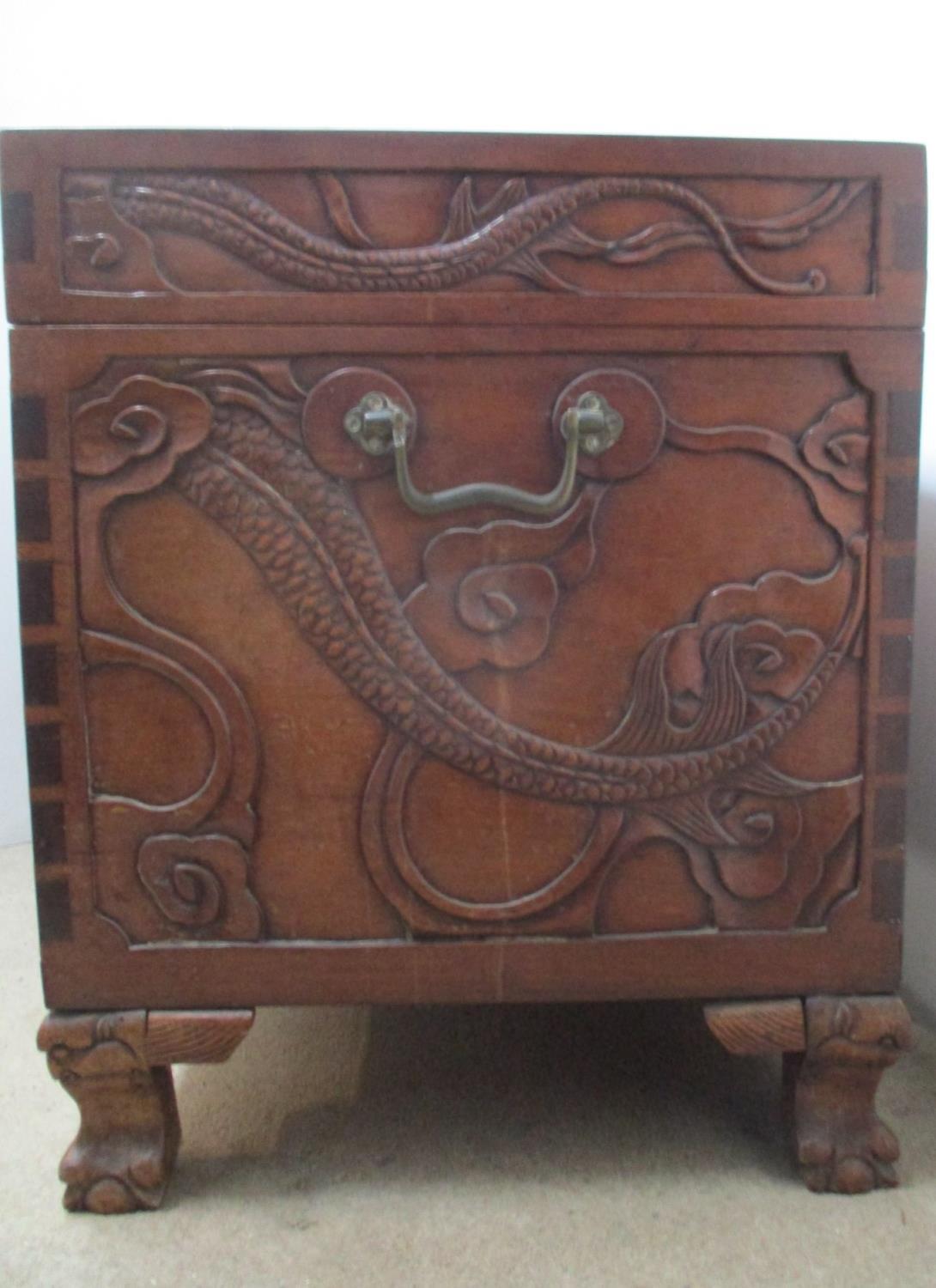 An early 20th century Chinese hardwood chest, the top, front and sides carved with dragons and - Image 5 of 6