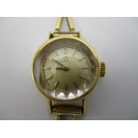 An Omega 14ct gold ladies wristwatch with a baton dial, on a V shaped link strap 17.42g total