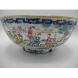 A late 18th century Chinese bowl decorated with panels of figures in garden settings and