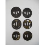 A fine collection of Japanese Meiji period tsubas, comprising shibuishi and iron pieces, some with