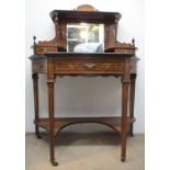 A late 19th century Amboyna and Marquetry writing table with scrolled leaf, ribbon and urn ornament,