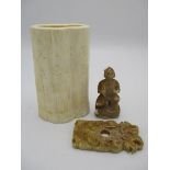 Asian carving, a section of bone decorated with a mountainous landscape and text, 5"h, a carved