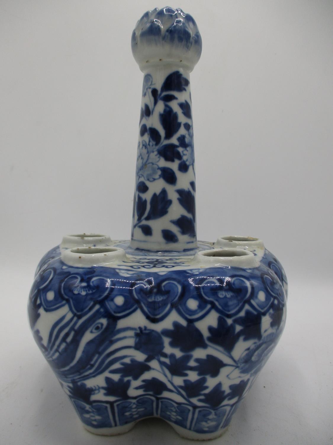 A 19th century tulip vase with a central column and five apertures below, on a lobed body, decorated