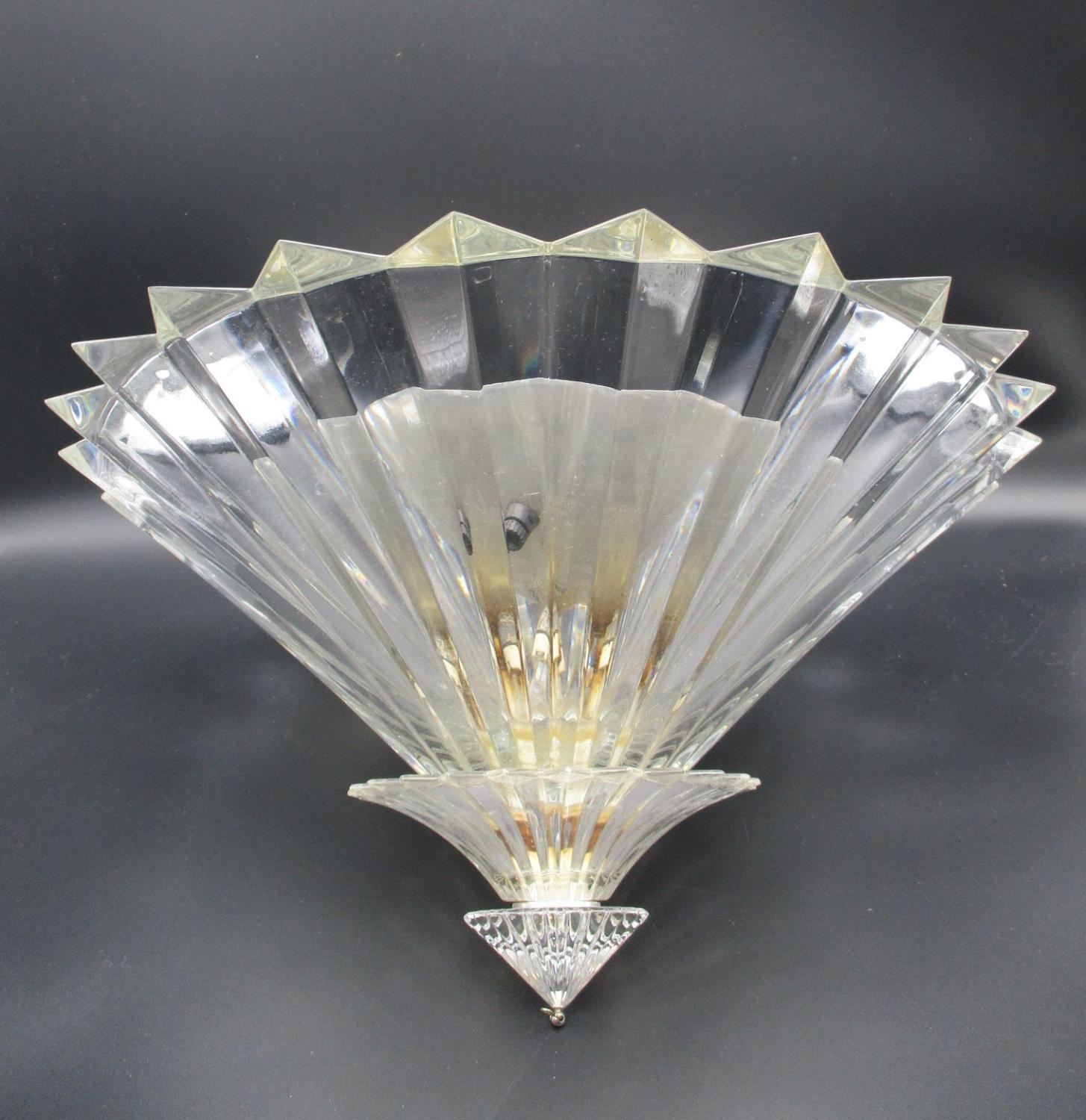 A Baccarat Mille Nuits crystal ceiling light with three prism design tiers, signed Mathias,