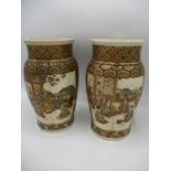 A pair of late 19th century Japanese Satsuma vases of lobed form decorated with panels of figures in