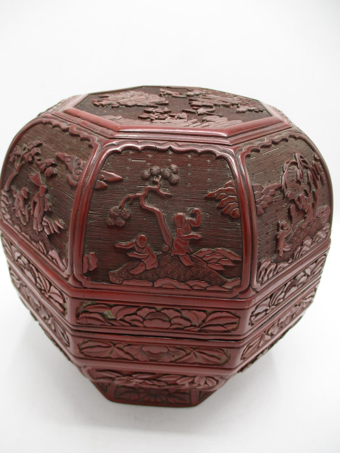 A large 19th century Chinese cinnabar box of octagonal form, the domed lid decorated with panels - Image 2 of 17