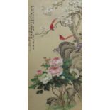 A large 20th century Chinese painted board depicting birds in a naturalistic setting with blossoming