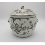 A late 19th century Chinese pot and cover of bulbous form decorated with a garden scene, a figure