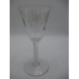 A mid 18th century English air twist and engraved wine glass, possibly of Williamite or Jacobite